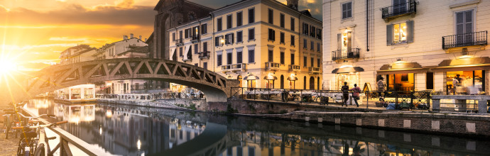 Bridge across the Naviglio Grande canal at the evening in Milan, Italy